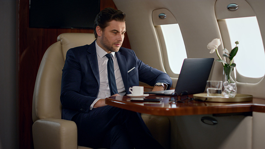 Passenger doing work on private jet