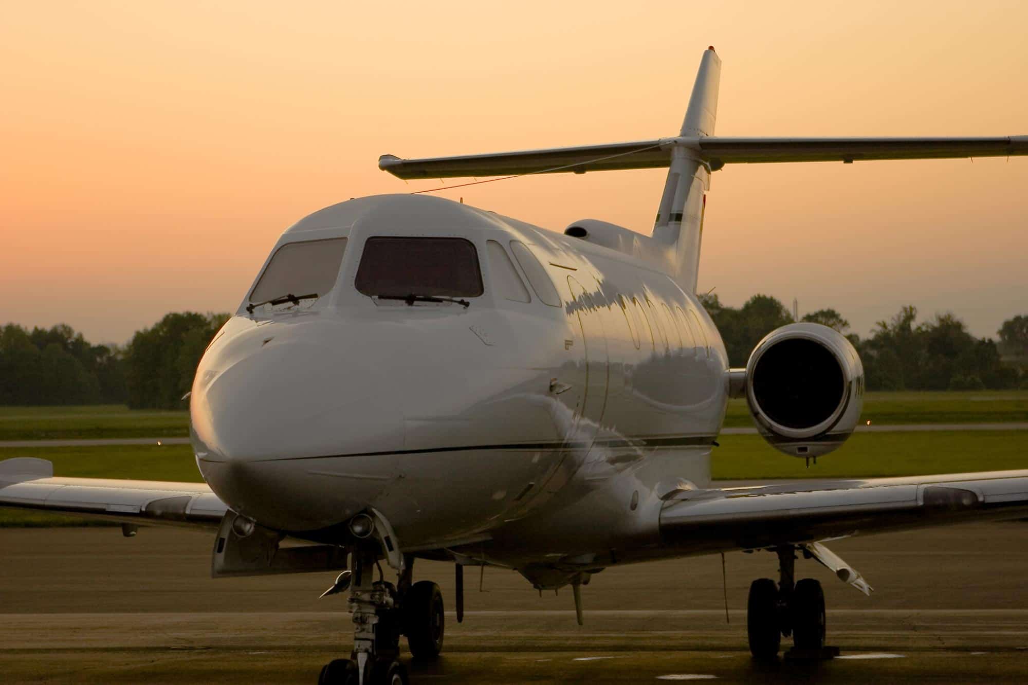 A private jet ready for take off at sunset