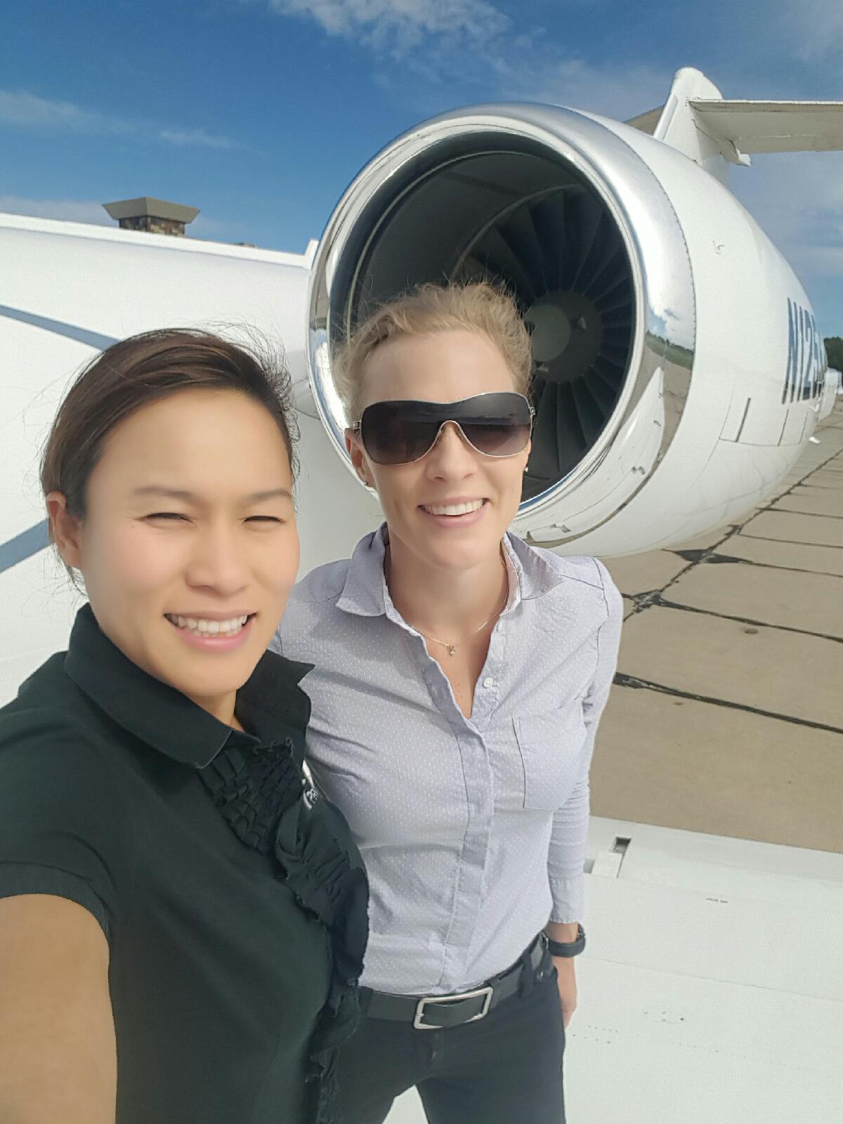 Nikki Wongvongsri and Madeleine Gilad in KCLE with a GIV on a charter trip in 2015